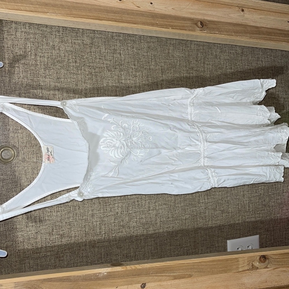 White romper size large. Open like armholes